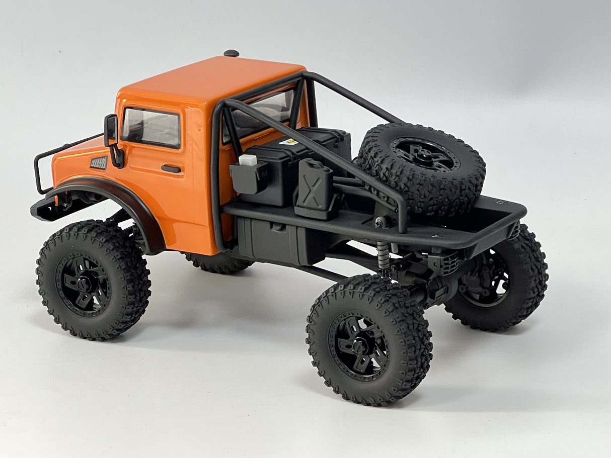 Rugged orange RC truck, the HobbyPlus 1/18 CR18P EVO Trail Hunter, ready for off-road adventure with its large knobby tires and sturdy design.