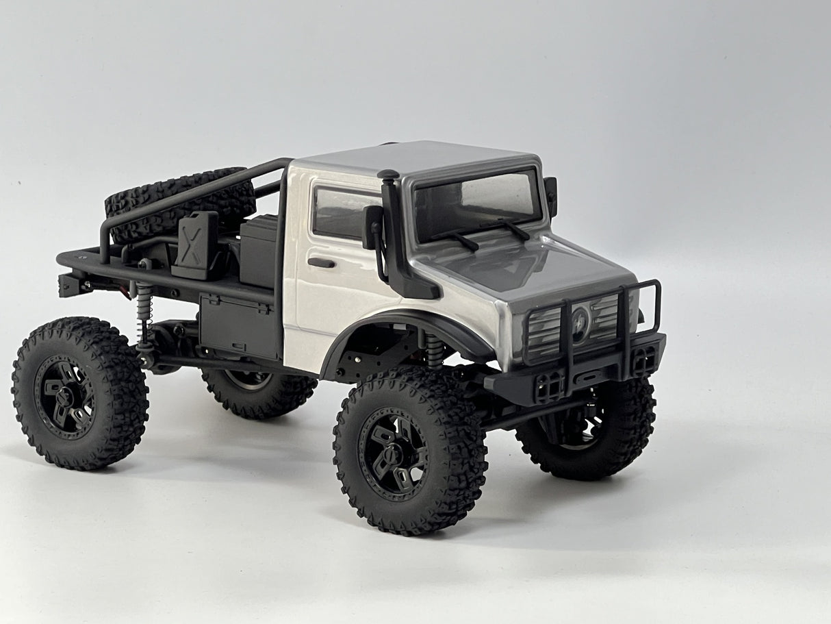 Rugged off-road RC truck, HobbyPlus 1/18 CR18P EVO Trail Hunter, silver metallic finish, knobby tires, aftermarket accessories.