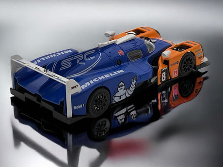 Detailed 1/32 scale SRC Slot Toyota LMP1 Chrono Series Michelin #8 slot car model in its display stand.
