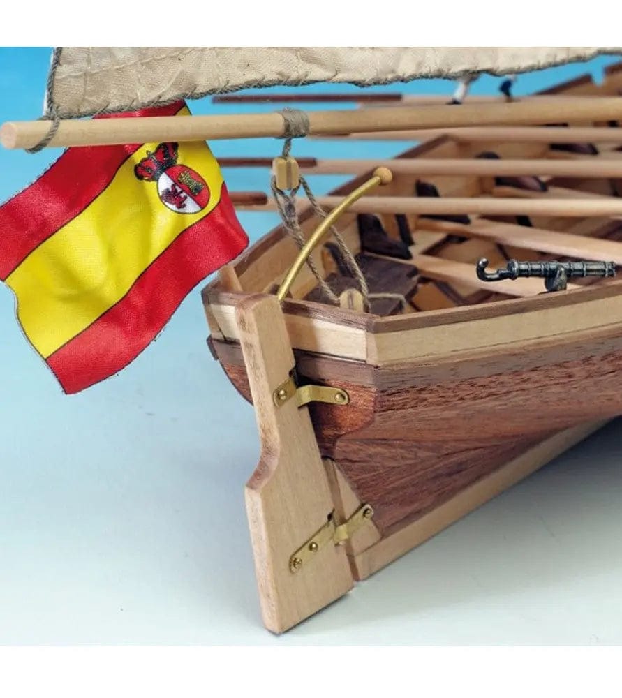 Detailed wooden model ship kit of the Spanish vessel San Juan Nepomuceno, including a Spanish flag placed on the deck.