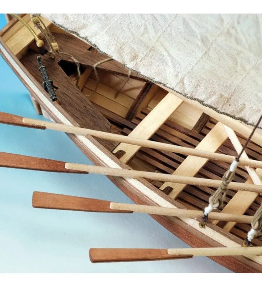 Detailed wooden model ship kit with intricate construction of the ship's frame and components