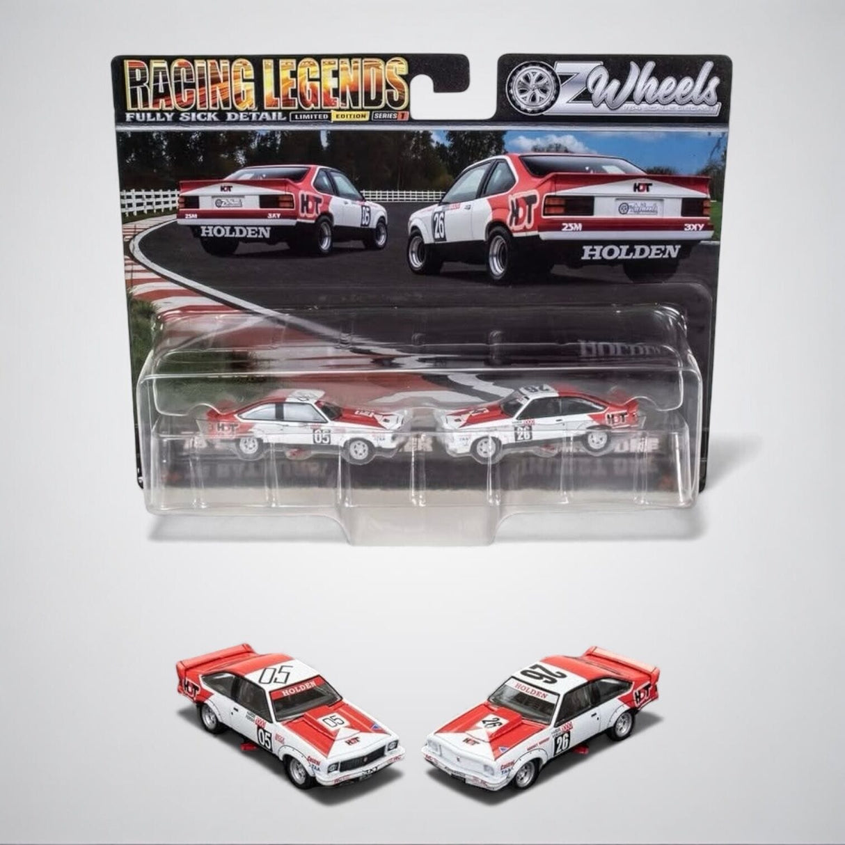 Two miniature model cars in front of their packaging, featuring 'Racing Legends' branding.