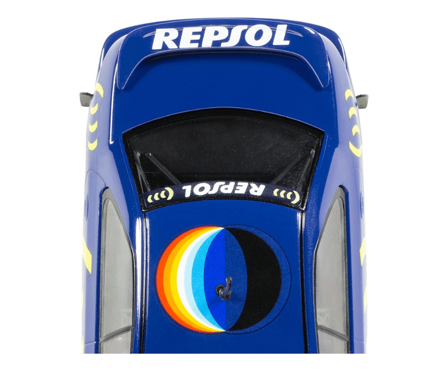 Detailed Scalextric Subaru Impreza WRX - Colin Mcrae 1995 World Champion Edition slot car model, featuring prominent Repsol branding and colorful design.