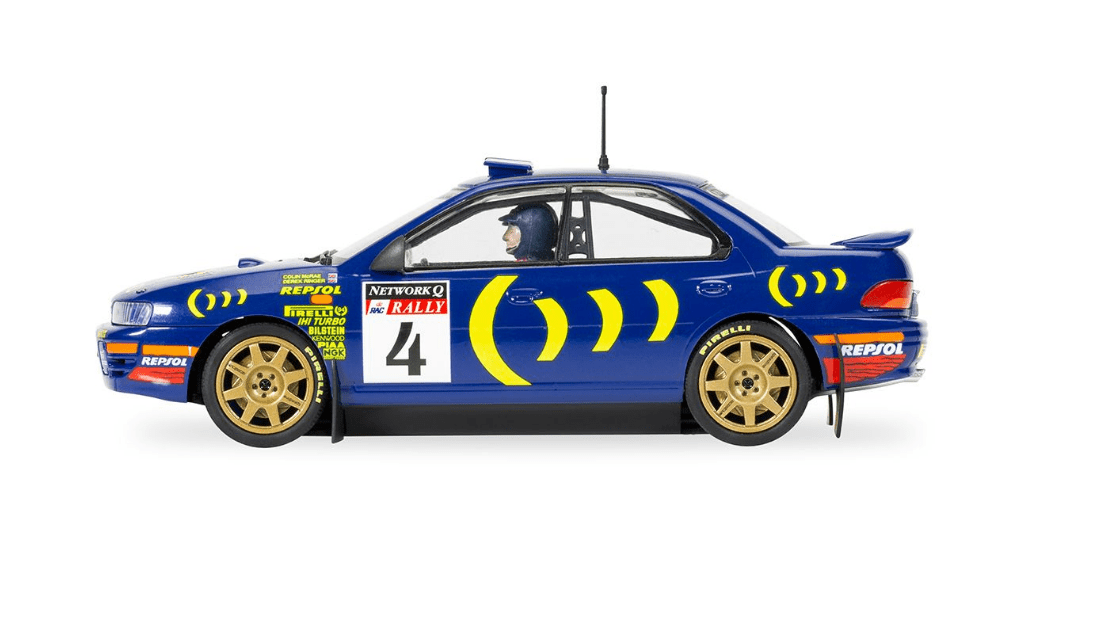 Detailed Scalextric Subaru Impreza WRX slot car in iconic rally design from 1995 World Champion Colin McRae.