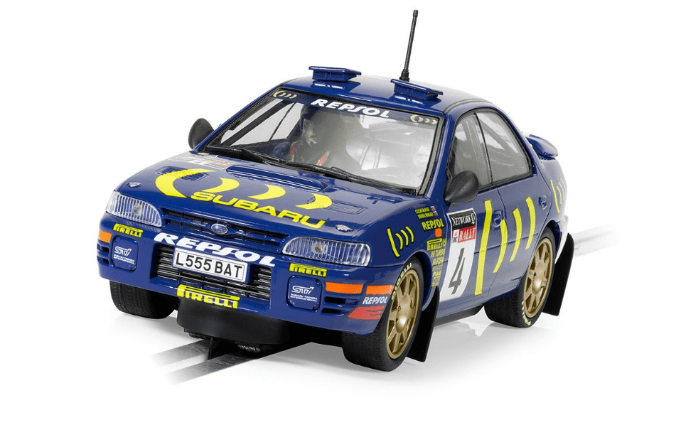 Detailed Scalextric model of Subaru Impreza WRX race car driven by champion Colin McRae in 1995.