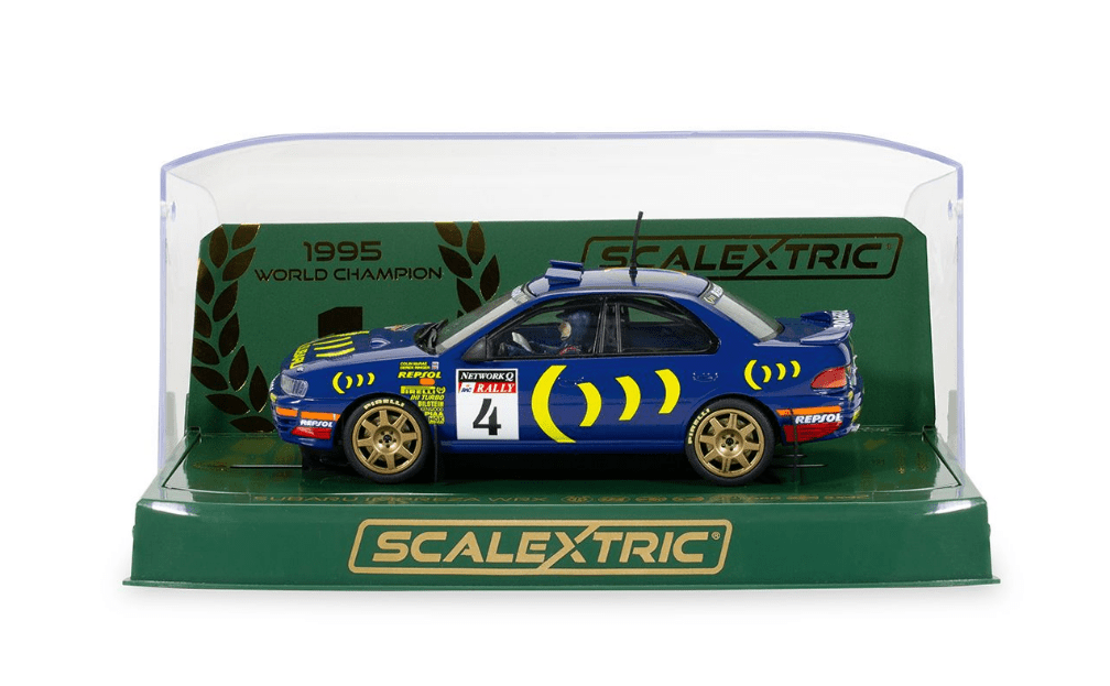 Scaled model of Subaru Impreza WRX rally car in commemorative 1995 World Champion Edition, displayed in a protective case.