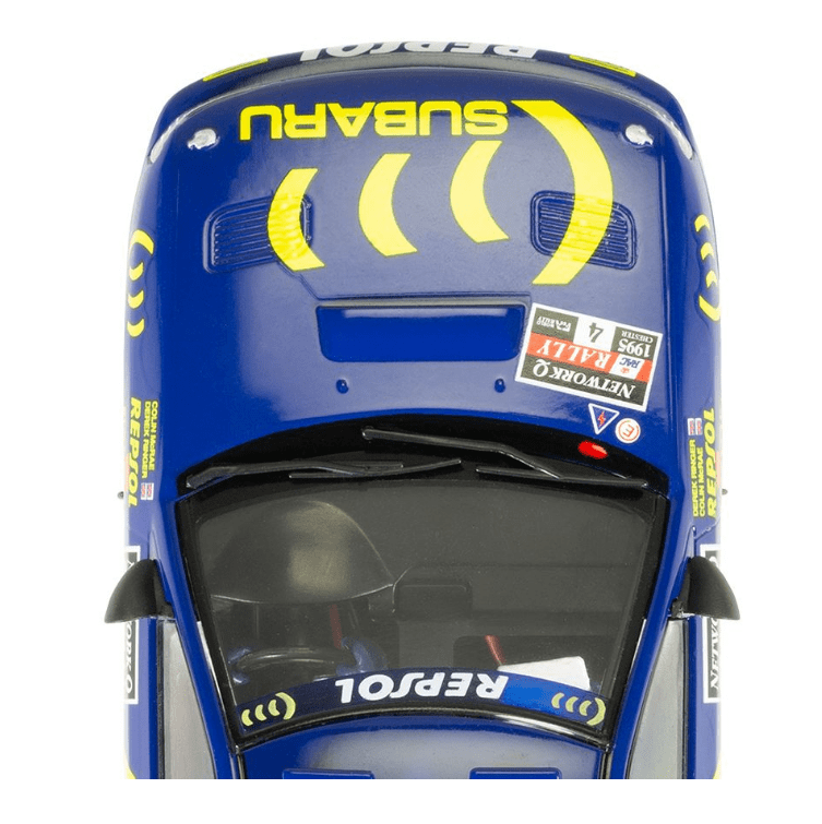 Blue and yellow Scalextric Subaru Impreza WRX racing car with graphics and details commemorating Colin McRae's 1995 World Champion title.