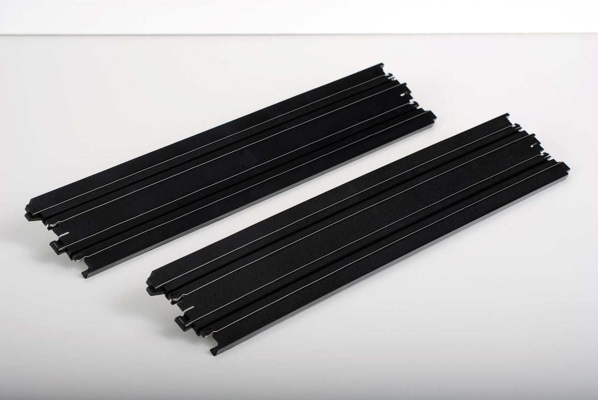Two black AFX 70600 15-inch straight track pieces for slot car racing.