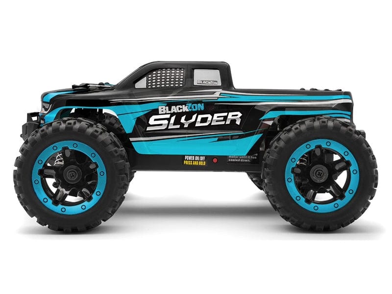 Blue and black electric monster truck with large off-road tires, aggressive styling, and prominent Blackzon Slyder branding.