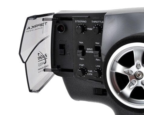 Futaba 3PRKA 2.4GHz remote control with steering and throttle adjustments, paired with R203GH receiver for radio-controlled model.