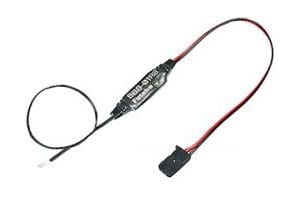 Compact brushless motor RPM sensor by Futaba. Sleek black design with red accents. Measures motor speed for RC hobbyists.