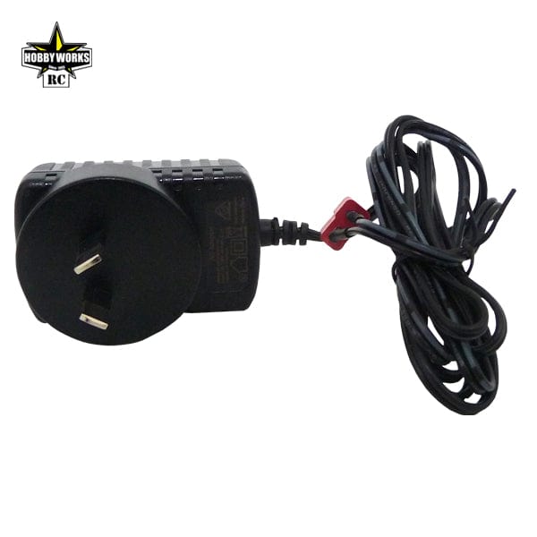 Compact green 1/10 scale Hobby Works Mud Digger V2 2WD electric monster truck with power adapter cable.