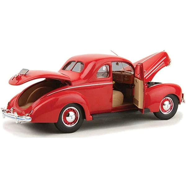 Detailed die-cast model of a vibrant red 1939 Ford Deluxe Coupe with classic vintage styling and a detailed interior.