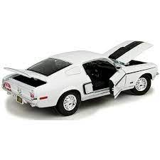 Detailed die-cast model of a 1968 Ford Mustang GR Cobra Jet FB in sleek white finish with intricate exterior features.