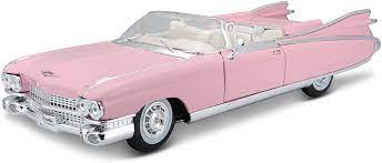 Detailed 1:18 scale model of a vibrant pink 1959 Cadillac Eldorado Biarritz convertible, showcasing the iconic retro automotive design.