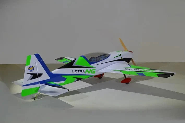 Sleek green and blue RC plane, Phoenix Model Extra Next Gen 50cc Carbon ARF, ready for high-performance flight.
