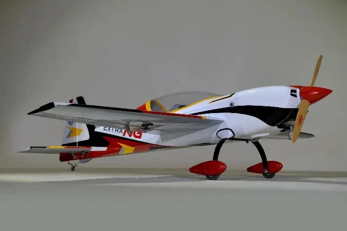 Sleek red and white Phoenix Model Extra Next Gen 50cc Carbon ARF RC plane on display.