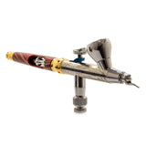 Harder & Steenbeck 2-in-1 dual-nozzle airbrush with 0.2mm and 0.4mm needle sizes, featuring a sleek red and yellow design.