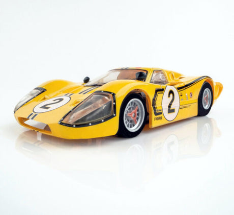Vibrant yellow racing slot car with striking design and racing number 2, showcasing dynamic styling and high-performance features.