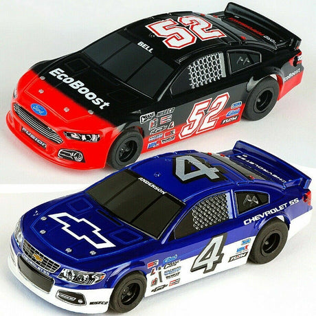 Two detailed NASCAR-style slot cars, one in red and black with the number 52, and the other in blue with the number 4, parked on a white surface.