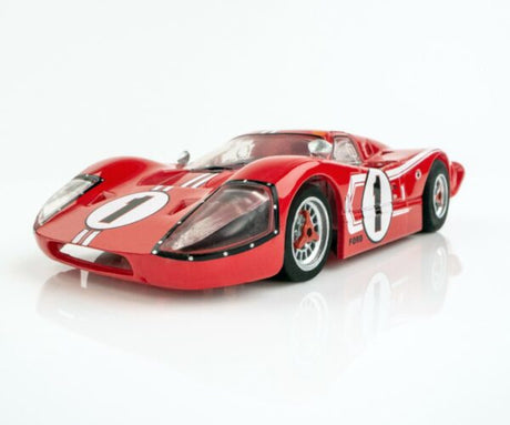 Detailed red slot car model of a Ford GT40 MKIV with racing #1 markings, displayed on a plain background.
