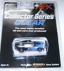 Detailed vintage black and blue 1973 Camaro slot car model, part of the Collector Series from AFX, showcasing its sleek design and high-quality features.