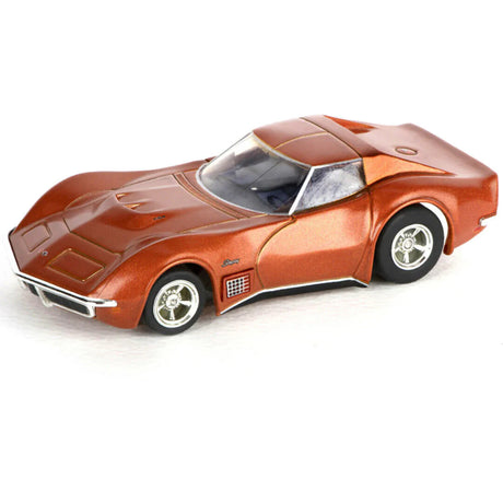 Sleek orange sports car model, the AFX 22047 Corvette 454 1971 Ontario, a highly detailed slot car for enthusiasts.