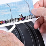 Three AFX brand safety barriers displayed in the image, with a checkered pattern design and the AFX logo visible. The barriers appear to be intended for use in slot car racing tracks, providing a protective border.