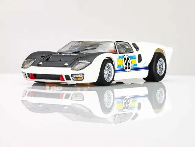 Sleek AFX 22057 HO Mega G+ Ford GT40 Mark II #96 racing slot car on a reflective surface.