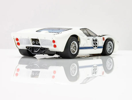 Sleek white Ford GT40 Mark II #96 racing slot car with striking blue accents, showcasing its powerful design and competitive racing pedigree.