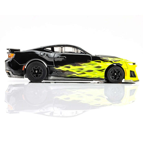 Detailed black and yellow Camaro ZL1 slot car with flame graphic design.