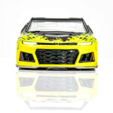 Sleek yellow Camaro ZL1 slot car with bold black and lime flame design, featuring an aggressive front grille and stylish headlights.