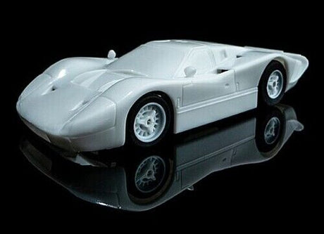 AFX 22070 Ford GT-40 Mk. IV Paintable slot car, a sleek and iconic racing model in a striking silver hue.
