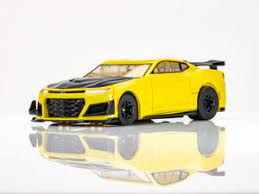 Yellow 2021 Camaro 1LE slot car with sporty design and racing stripes.