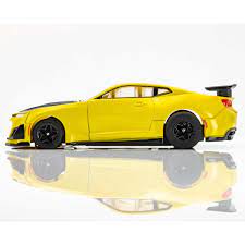 Sleek yellow Camaro 1LE slot car with aggressive aero styling and sporty black accents.