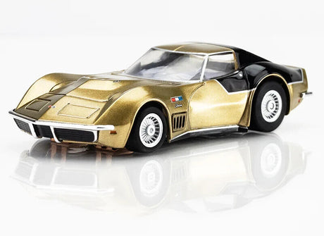 Sleek gold and black Mega G 1969 Astro Vette LMP12 slot car, a high-performance racing model from the AFX brand.