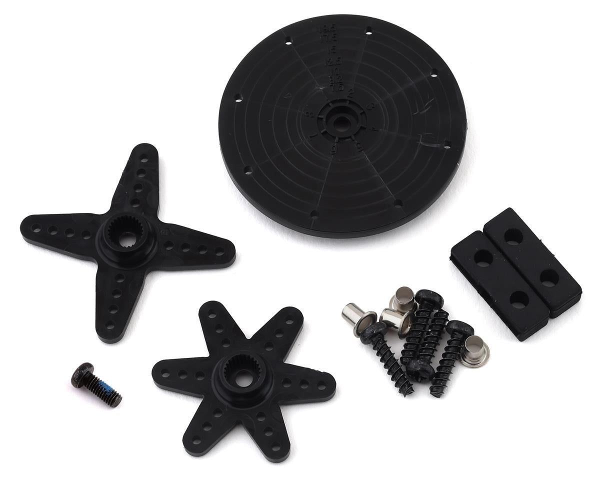 Black high-voltage digital servo components for radio-controlled aircraft, including a circular hub, cross-shaped attachments, and assorted mounting hardware and screws.