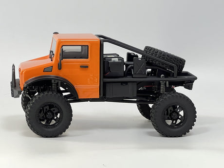 Rugged orange RC truck with off-road tires ready for adventure.