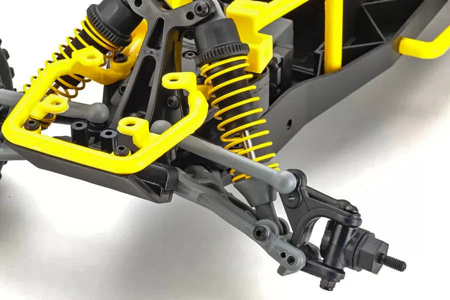 Detailed electric RC buggy with yellow and black chassis, coil suspension, and off-road tires for rugged terrain driving.