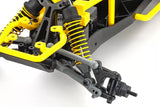 Kyosho 1/10 Sandmaster 2.0 Electric RTR RC Buggy - Yellow. Detailed image of the rear suspension components, including yellow coil springs, dampers, and wheel axle.