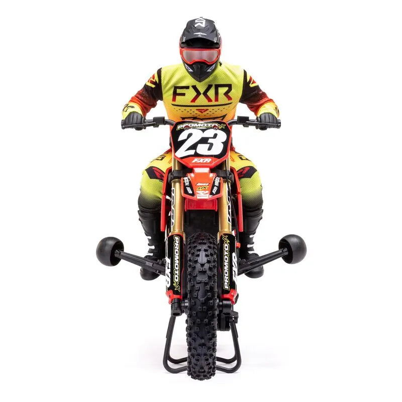 Detailed RC motorcycle with FXR branding, number 23, and rider in protective gear on white background.