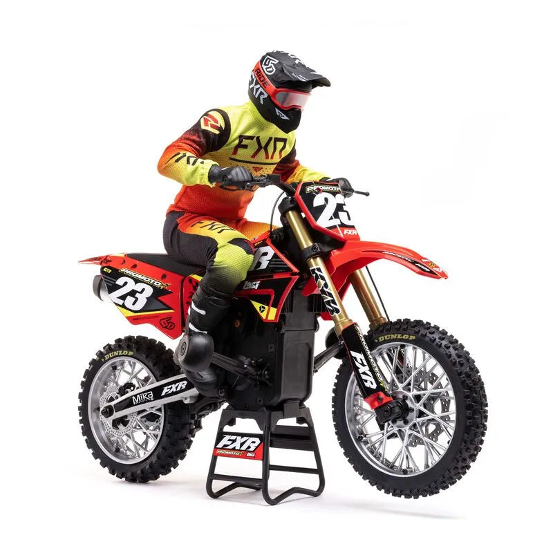 Detailed RC motorcycle in vibrant red and yellow colors, with rider in full protective gear, ready for an off-road adventure.