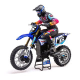 High-performance stunt motorcycle with colorful sponsor decals, ready for extreme off-road racing.