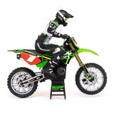 Detailed RC motorcycle model from Losi, featuring a black, green and red color scheme. The detailed and realistic-looking motorcycle is displayed on a stand, showcasing its intricate design and features.