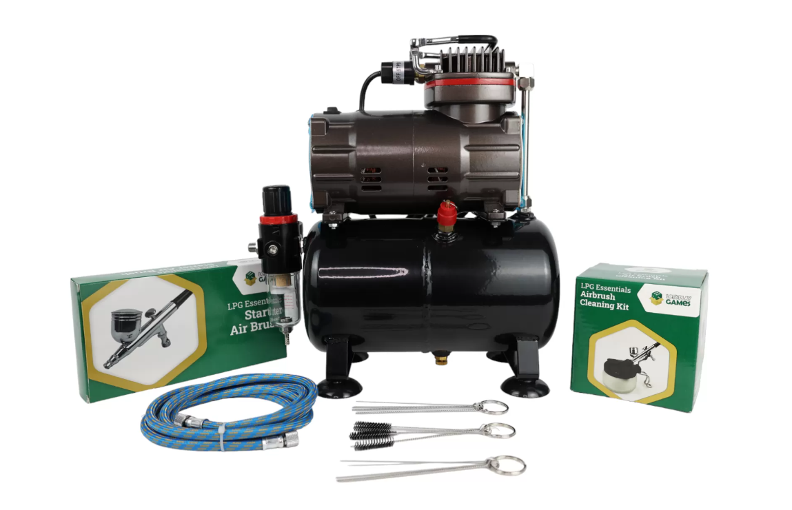 Portable compressor and airbrush starter kit for hobby and craft projects in toy section.