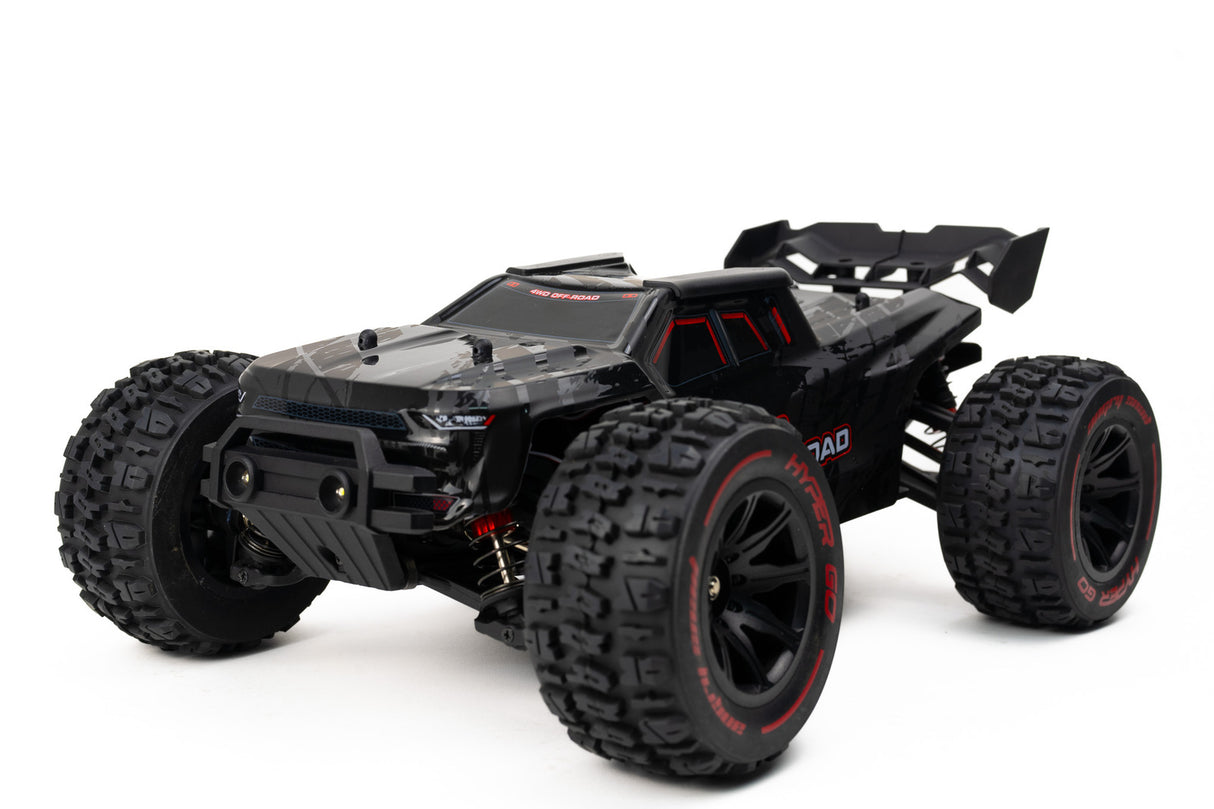 High-speed off-road brushless RC truggy with 4WD capabilities and aggressive tires for outdoor adventure.