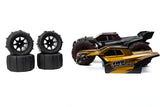 High-speed off-road RC truggy with detailed black and gold bodywork, thick treaded tires, and powerful brushless motor.