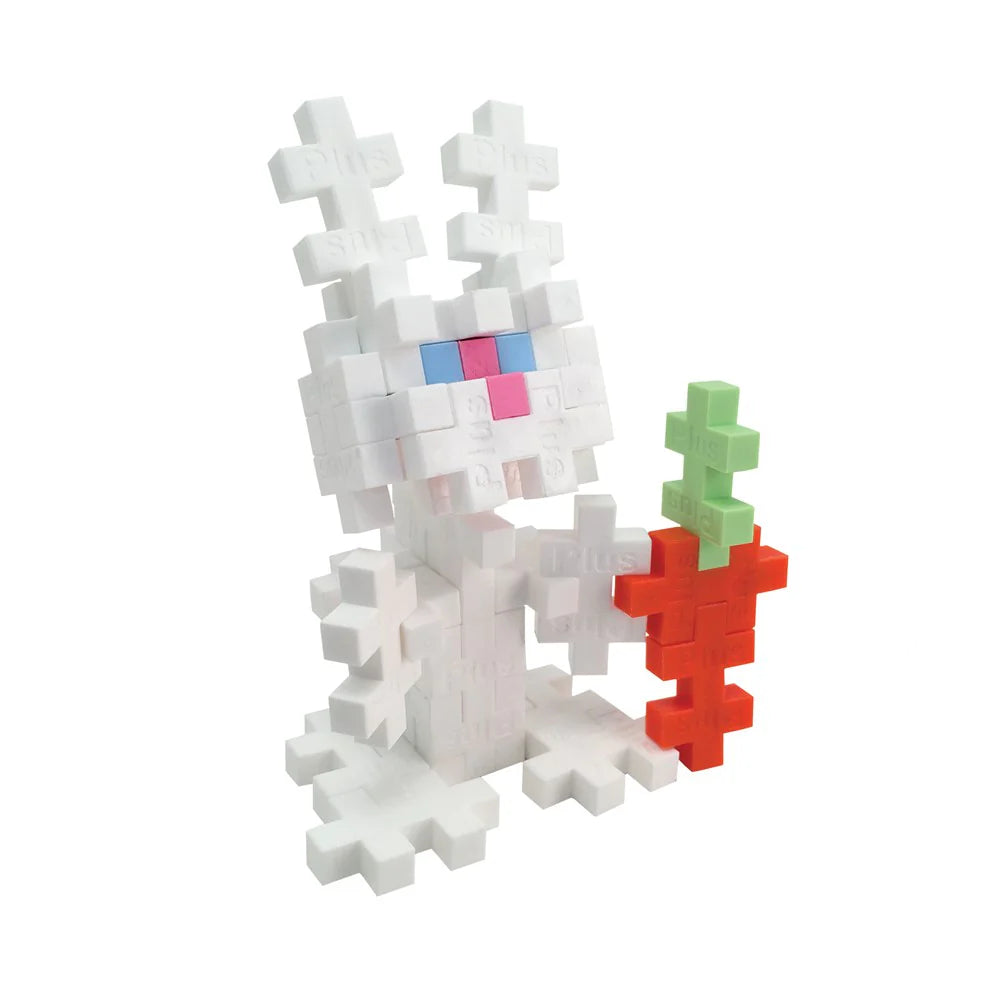 a white rabbit holding a carrot made out of lego blocks