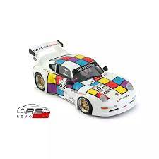 Colorful Porsche 911 GT2 model car from REVO Slot, featuring a bold, abstract paint scheme and detailed racing design.