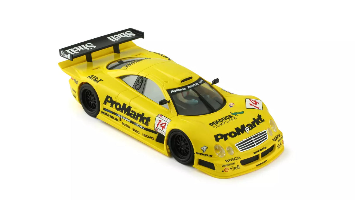 Detailed 1/32 scale Mercedes CLK GTR slot car with ProMarkt racing livery, featuring a sleek yellow body, black trim, and sponsor branding.